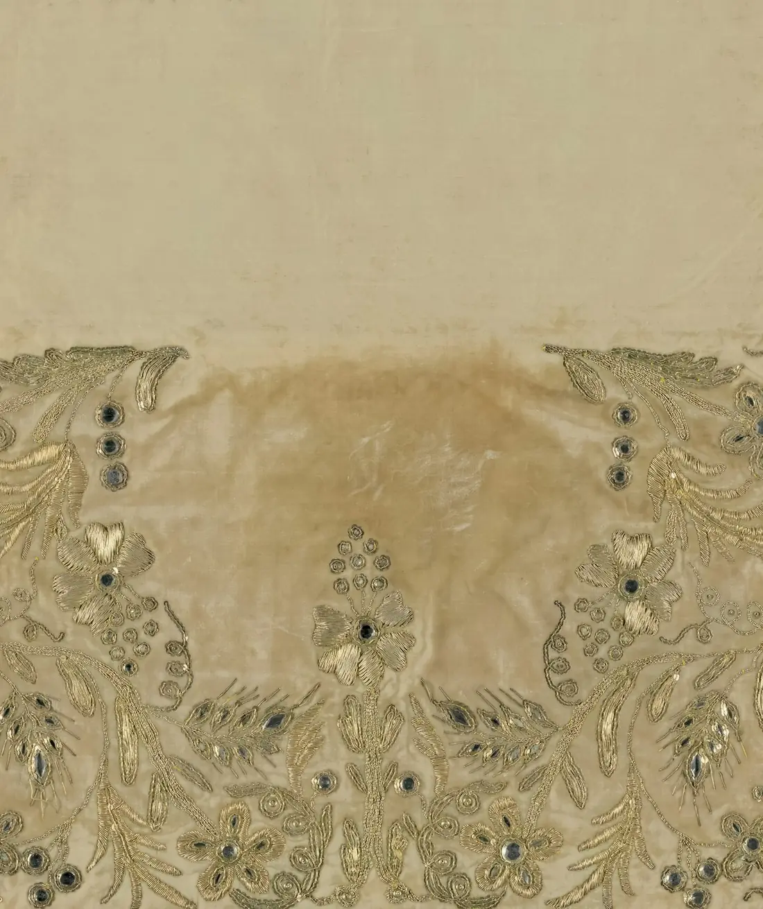 Close-up of cream fabric with beaded embroidery