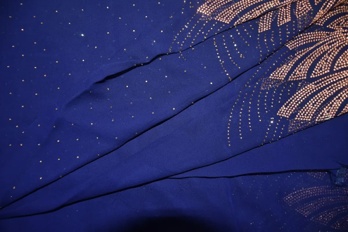 Close-up of blue silk with gold embroidery